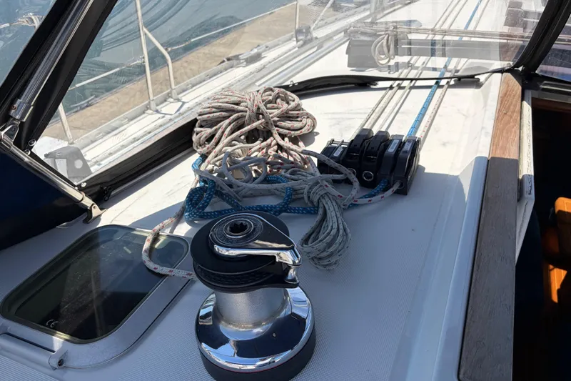 Slide: The Image of Deck of 1998 Jeanneau Sun Odyssey 45.2 sailboat with winch and coiled ropes. - 31