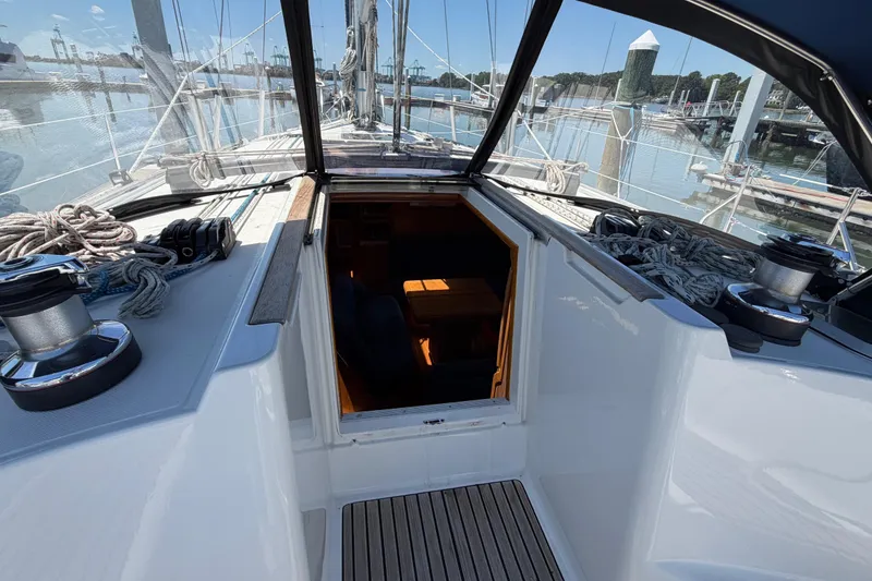 Slide: The Image of Cockpit view of 1998 Jeanneau Sun Odyssey 45.2 sailboat, showcasing deck and cabin entrance. - 32