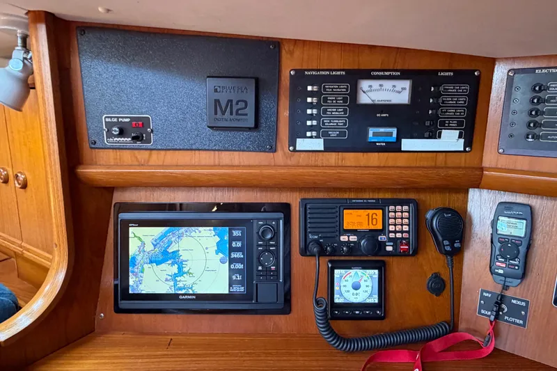 Slide: The Image of Control panel of a 1998 Jeanneau Sun Odyssey 45.2 sailboat with navigation equipment. - 43