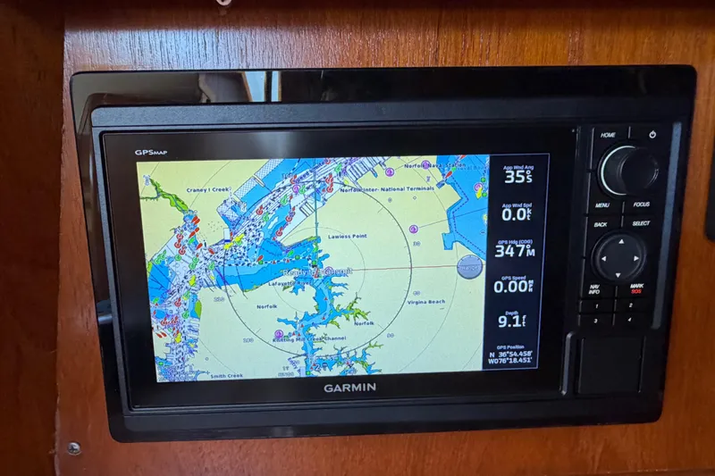 Slide: The Image of Garmin GPS display on 1998 Jeanneau Sun Odyssey 45.2, showing nautical map and navigation data. - 44