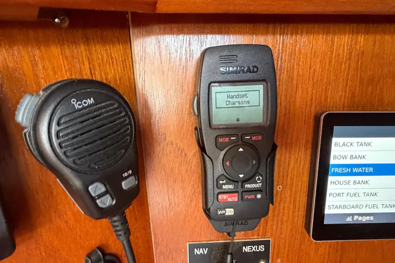 Slide: The Image of Simrad and Icom marine electronics on Jeanneau Sun Odyssey 45.2, 1998 model. - 48