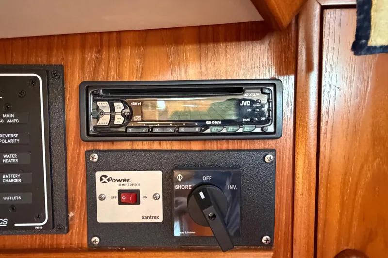 Slide: The Image of Control panel on a 1998 Jeanneau Sun Odyssey 45.2 yacht with JVC stereo and Xantrex switch. - 53