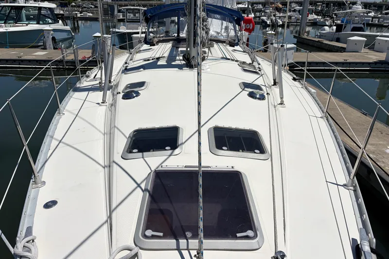 Slide: The Image of Jeanneau Sun Odyssey 45.2 sailboat, 1998 model, docked at marina with visible deck features. - 6