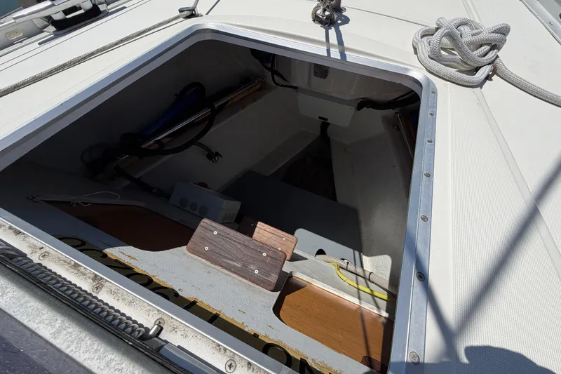 Slide: The Image of Open hatch on Jeanneau Sun Odyssey 45.2 sailboat, showcasing interior storage space. - 7