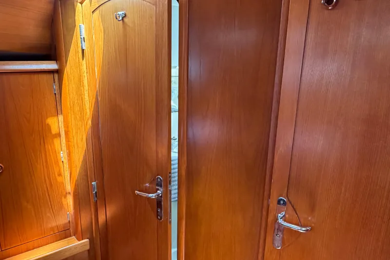 Slide: The Image of Wooden interior doors on a 1998 Jeanneau Sun Odyssey 45.2 yacht. - 73