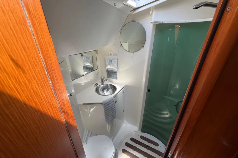Slide: The Image of Bathroom interior of 1998 Jeanneau Sun Odyssey 45.2 yacht, featuring sink and shower. - 74