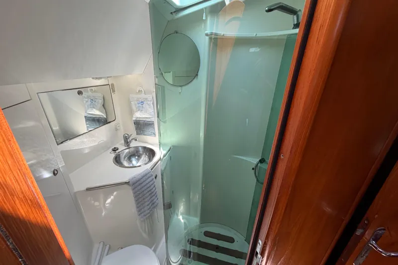 Slide: The Image of Bathroom interior of 1998 Jeanneau Sun Odyssey 45.2 yacht, featuring shower and sink. - 75