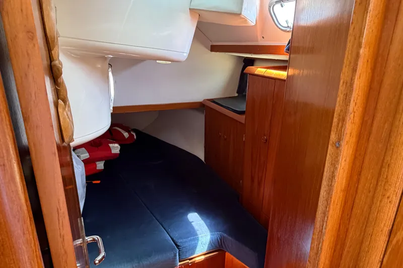 Slide: The Image of Cozy cabin interior of 1998 Jeanneau Sun Odyssey 45.2 sailboat with wooden furnishings. - 77