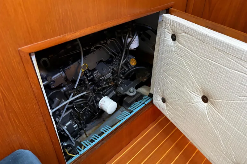 Slide: The Image of Engine compartment of 1998 Jeanneau Sun Odyssey 45.2 sailboat, showcasing mechanical components. - 83