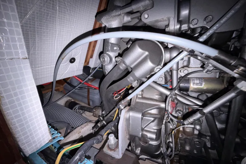 Slide: The Image of Engine compartment of a 1998 Jeanneau Sun Odyssey 45.2 sailboat, showing mechanical components. - 85