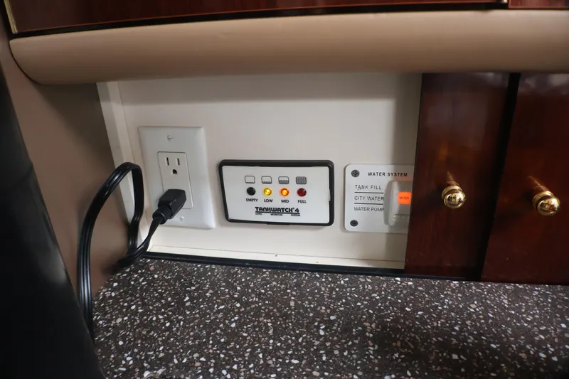 Slide: The Image of Control panel and outlet in 2003 Formula 400 Super Sport boat interior. - 23