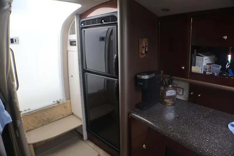 Slide: The Image of Interior of 2003 Formula 400 Super Sport yacht with kitchenette and appliances. - 25