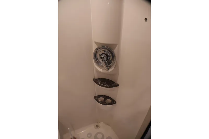 Slide: The Image of Shower control panel in a 2003 Formula 400 Super Sport boat bathroom. - 28