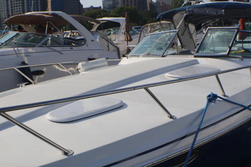Slide: The Image of 2003 Formula 400 Super Sport boat docked among other vessels in a marina. - 3