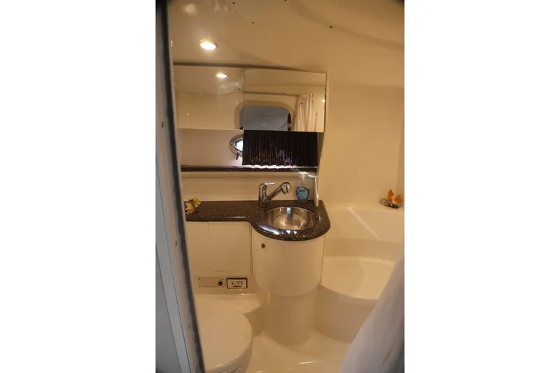 Slide: The Image of 2003 Formula 400 Super Sport yacht bathroom with sink, mirror, and modern fixtures. - 33