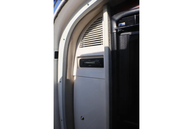 Slide: The Image of Interior detail of a 2003 Formula 400 Super Sport boat, featuring a vented panel. - 37