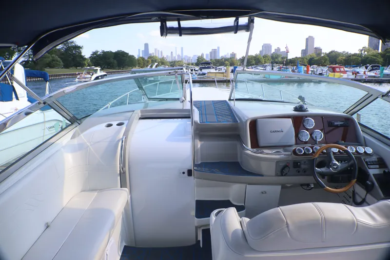 Slide: The Image of Interior view of a 2003 Formula 400 Super Sport boat with city skyline in background. - 40
