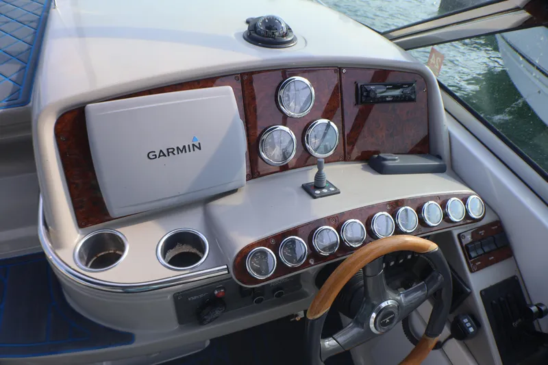 Slide: The Image of Dashboard of a 2003 Formula 400 Super Sport boat with Garmin navigation system. - 43
