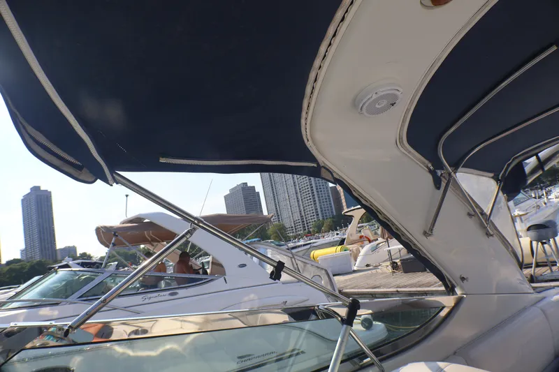 Slide: The Image of 2003 Formula 400 Super Sport yacht docked in a marina with city skyline. - 46
