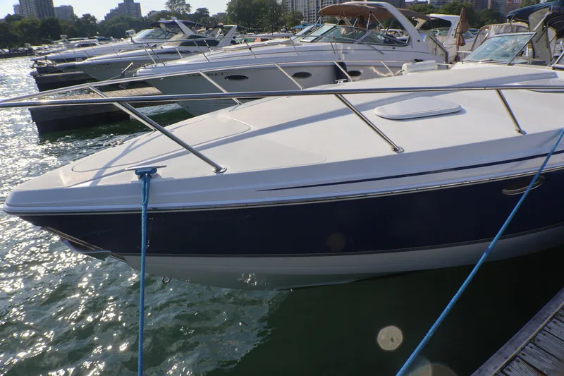 Slide: The Image of 2003 Formula 400 Super Sport boat docked at marina, sunny day. - 5