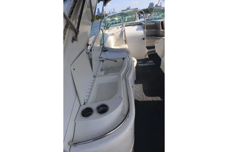 Slide: The Image of 2003 Formula 400 Super Sport boat interior with seating and cup holders. - 55