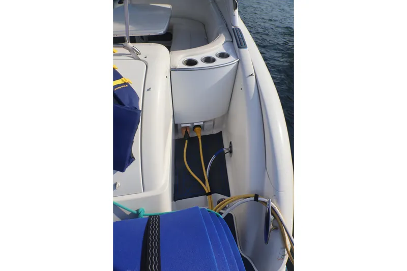 Slide: The Image of 2003 Formula 400 Super Sport boat deck with cables and seating area. - 58