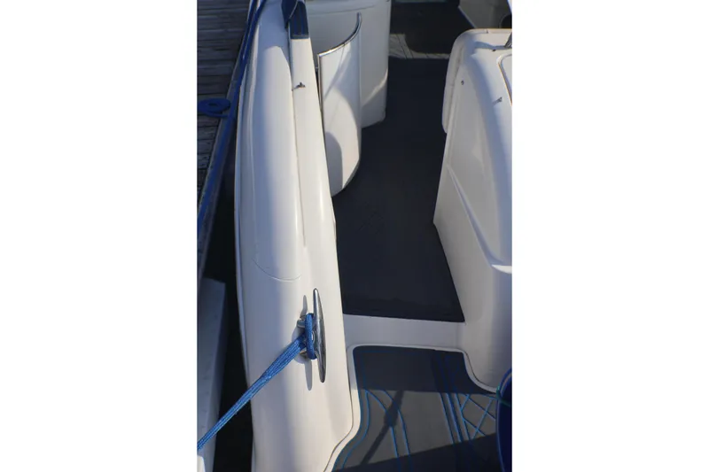 Slide: The Image of 2003 Formula 400 Super Sport boat deck with blue rope and sleek design. - 59