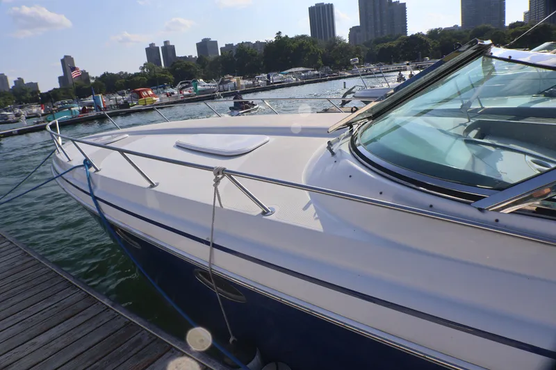 Slide: The Image of 2003 Formula 400 Super Sport yacht docked at marina with city skyline. - 6