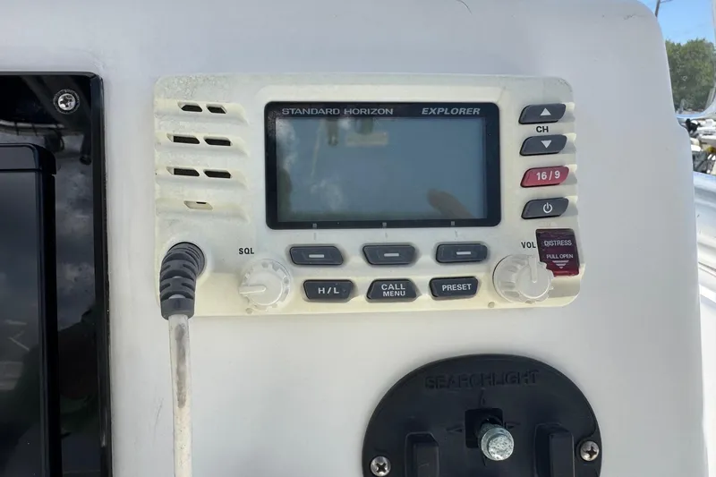 Slide: The Image of Standard Horizon Explorer radio on 2011 Tidewater 230 CC Adventure boat dashboard. - 17