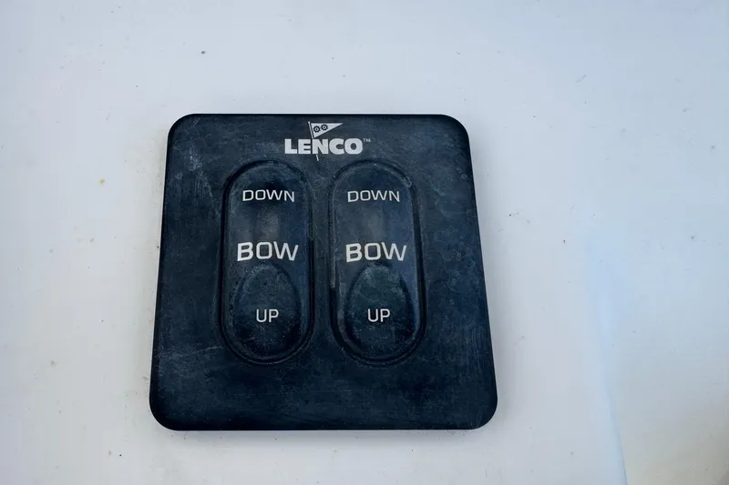 Slide: The Image of Lenco trim tab control panel on 2011 Tidewater 230 CC Adventure boat. - 18