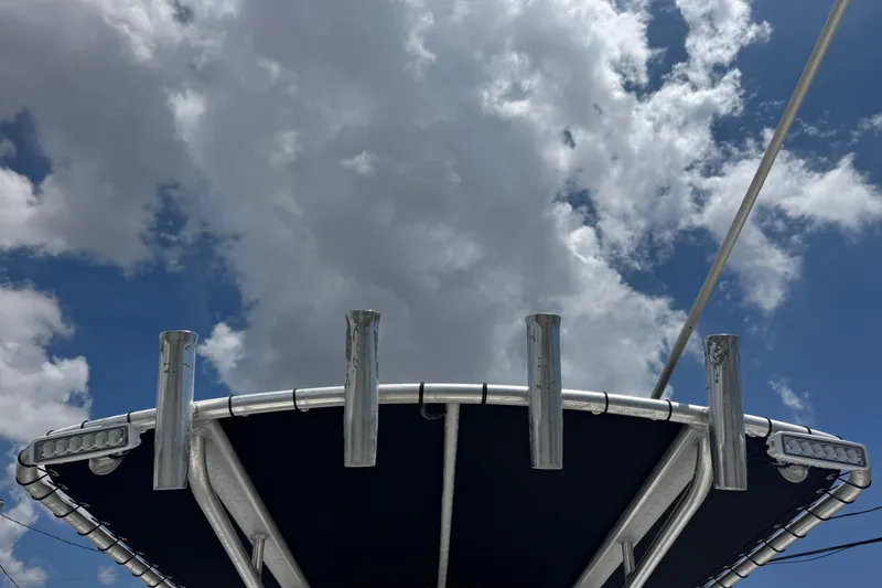 Slide: The Image of Tidewater 230 CC Adventure boat canopy against a cloudy sky, 2011 model. - 22
