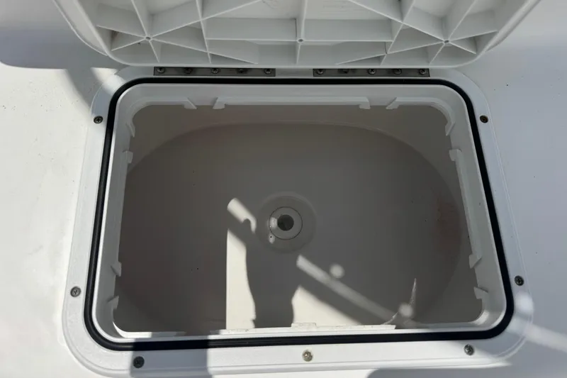 Slide: The Image of Open storage compartment on a 2011 Tidewater 230 CC Adventure boat. - 25