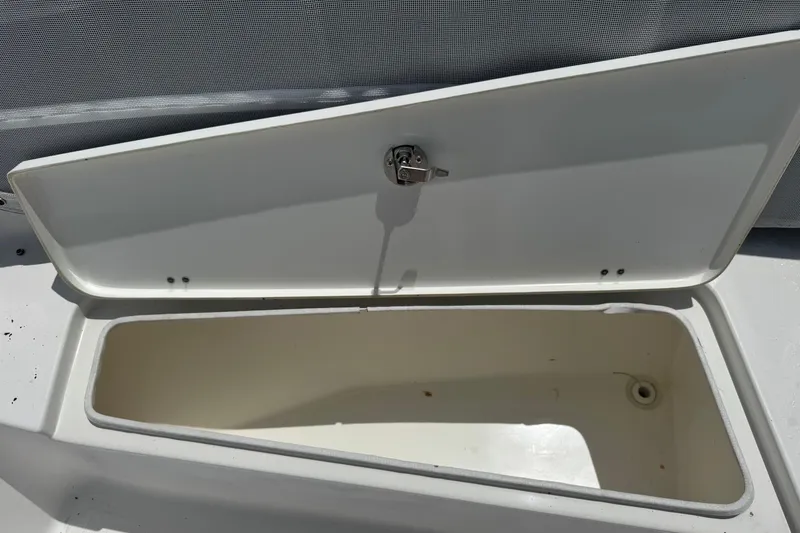 Slide: The Image of Open storage compartment on 2011 Tidewater 230 CC Adventure boat. - 27