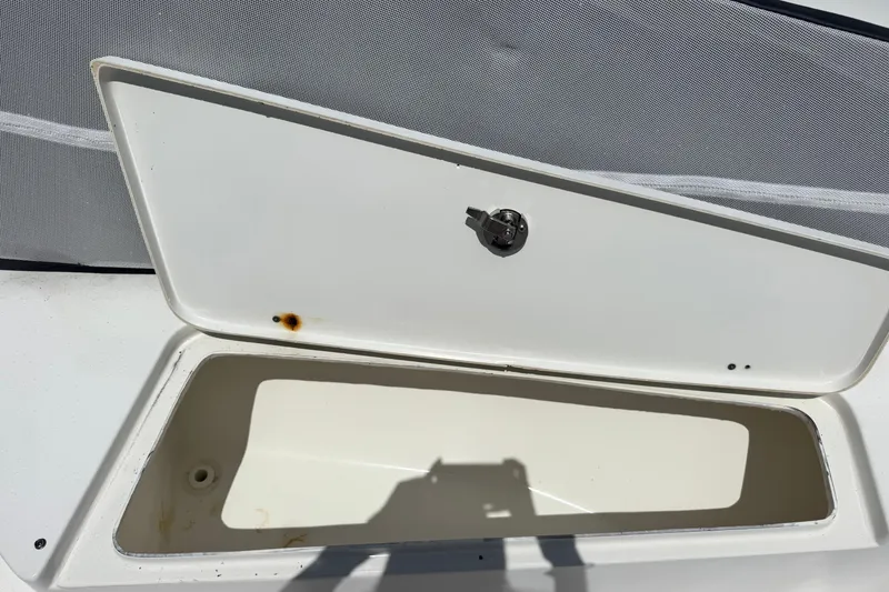 Slide: The Image of Open storage compartment on 2011 Tidewater 230 CC Adventure boat. - 29