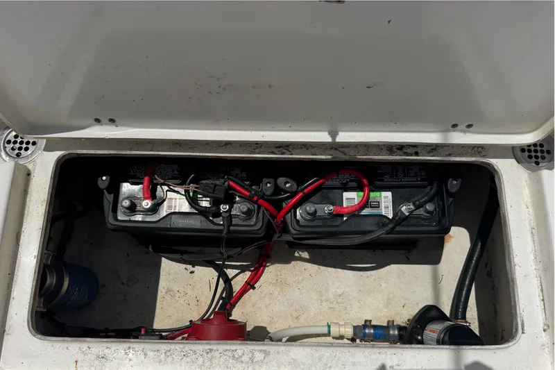Slide: The Image of Battery compartment of a 2011 Tidewater 230 CC Adventure boat with wiring connections. - 33