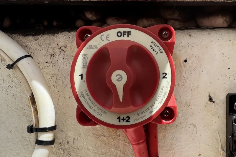 Slide: The Image of Red battery selector switch on a 2011 Tidewater 230 CC Adventure boat. - 34