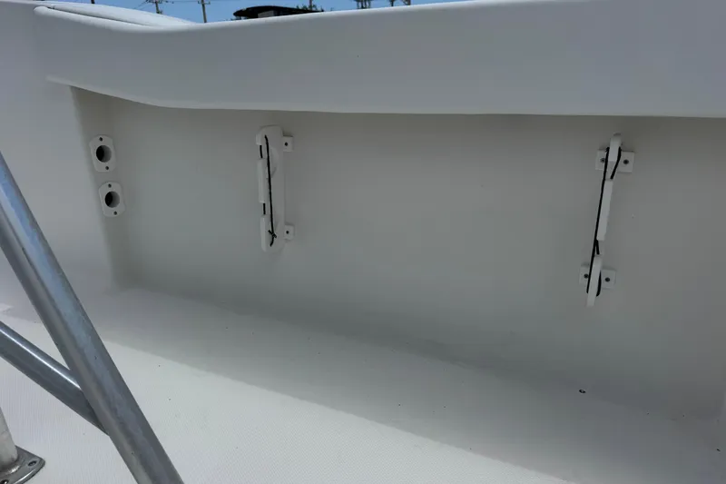 Slide: The Image of Interior view of a 2011 Tidewater 230 CC Adventure boat, showcasing white fittings. - 35