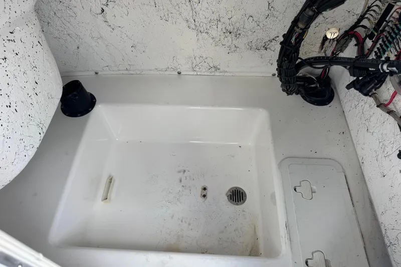 Slide: The Image of Interior view of a 2011 Tidewater 230 CC Adventure boat's storage compartment. - 39