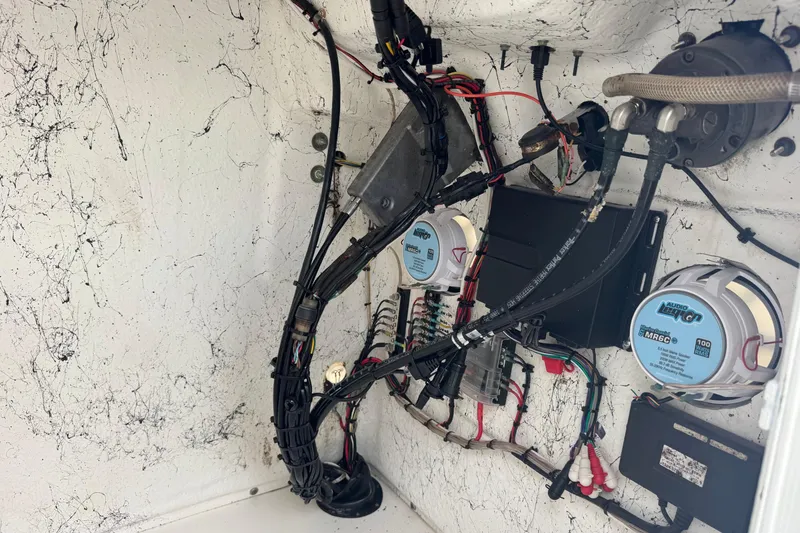 Slide: The Image of Electrical wiring and components inside a 2011 Tidewater 230 CC Adventure boat. - 40