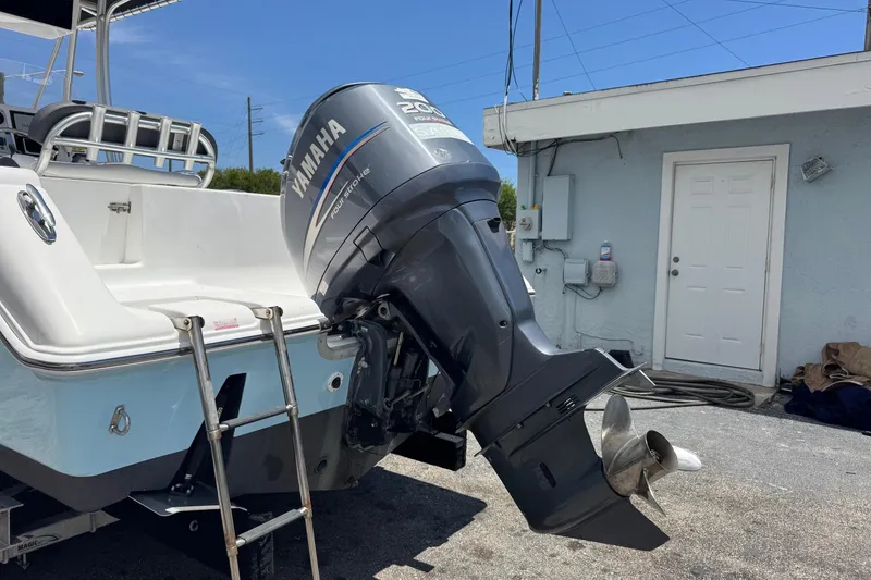 Slide: The Image of 2011 Tidewater 230 CC Adventure boat with Yamaha outboard motor and ladder. - 41