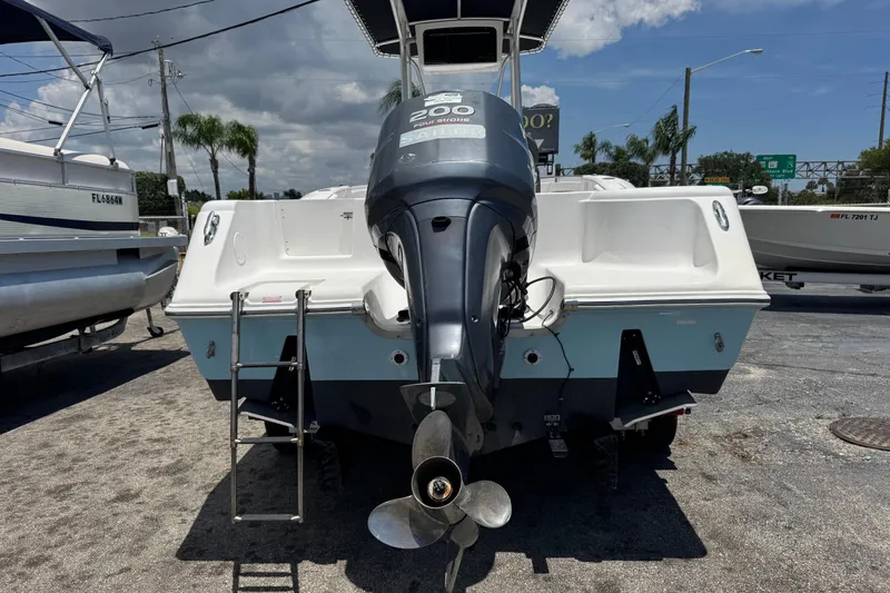 Slide: The Image of Rear view of a 2011 Tidewater 230 CC Adventure boat with outboard motor. - 42