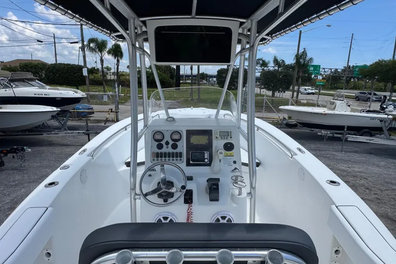 Slide: The Image of 2011 Tidewater 230 CC Adventure boat cockpit with steering wheel and control panel. - 5