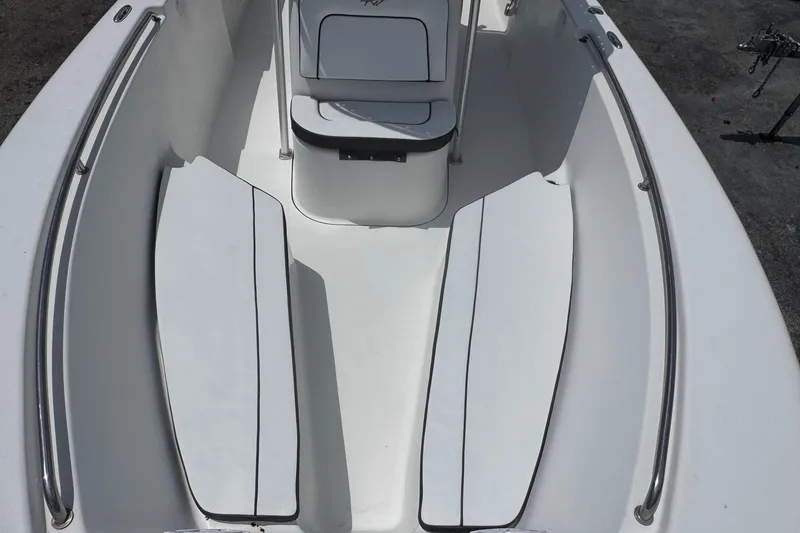 Slide: The Image of 2011 Tidewater 230 CC Adventure boat interior with seating and storage compartments. - 9