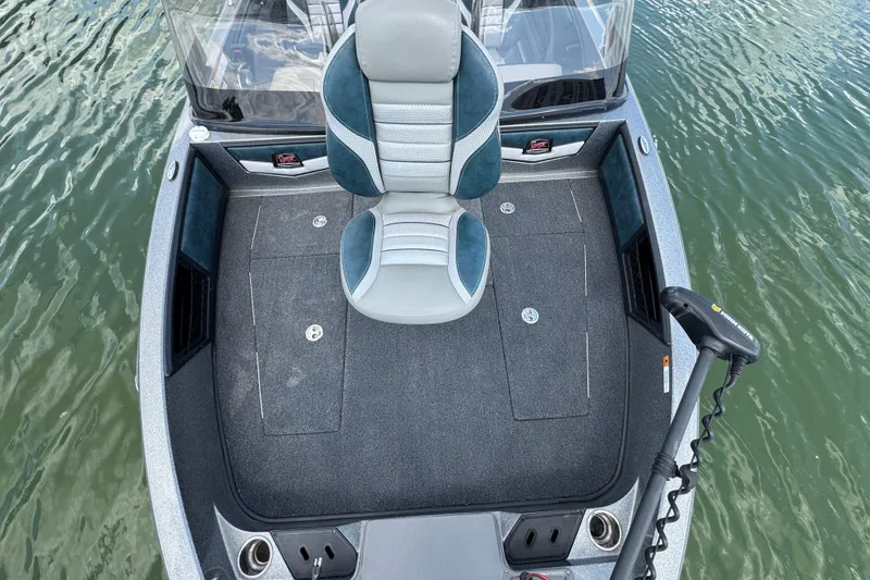 Slide: The Image of 2020 Ranger 2080MS Angler boat interior with seating and fishing deck on water. - 14