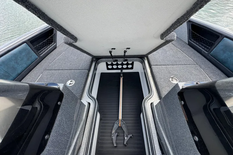 Slide: The Image of 2020 Ranger 2080MS Angler boat interior with open storage compartment. - 17
