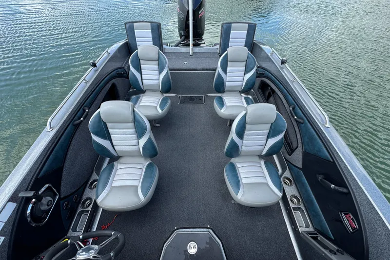 Slide: The Image of 2020 Ranger 2080MS Angler boat interior with four seats on calm water. - 20