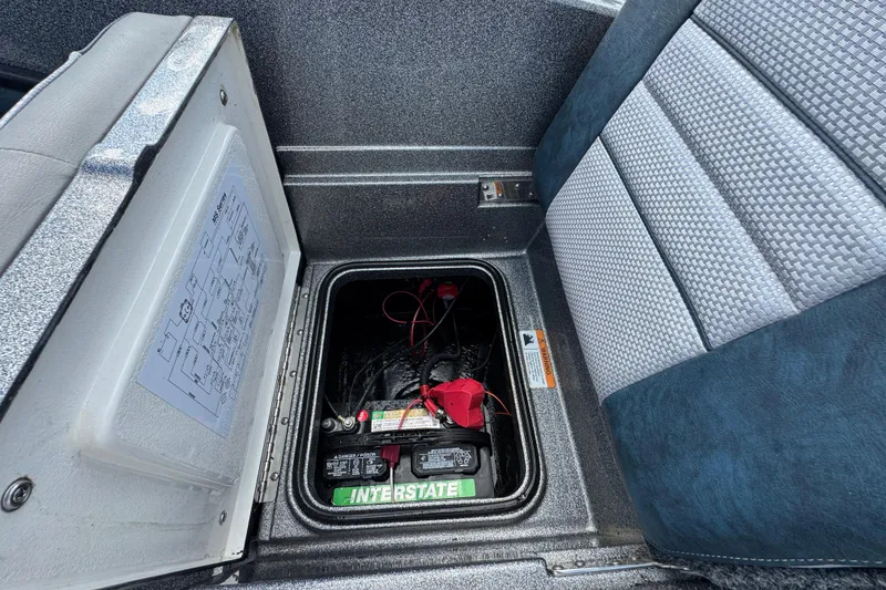 Slide: The Image of Battery compartment of a 2020 Ranger 2080MS Angler boat, featuring Interstate battery. - 22