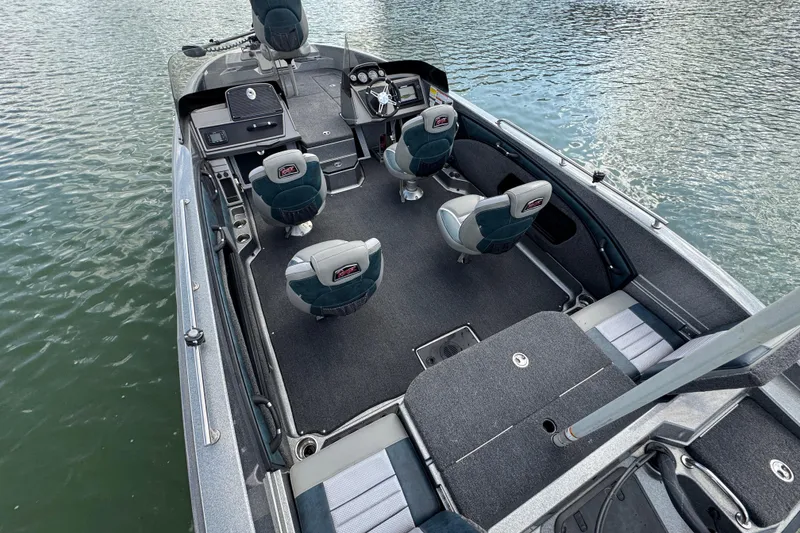 Slide: The Image of 2020 Ranger 2080MS Angler boat interior with seating and steering console on water. - 24