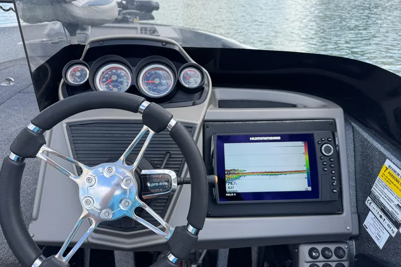 Slide: The Image of 2020 Ranger 2080MS Angler dashboard with steering wheel and Humminbird fish finder display. - 25