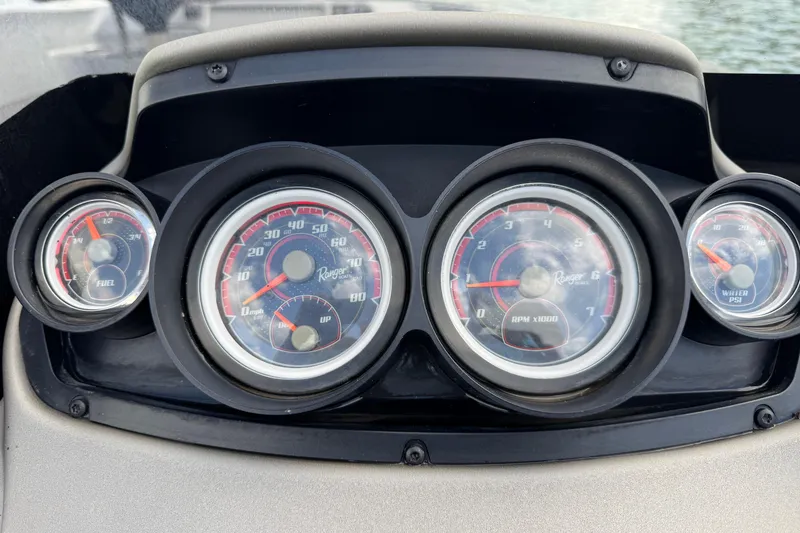 Slide: The Image of Dashboard of a 2020 Ranger 2080MS Angler boat with gauges for speed, RPM, fuel, and water pressure. - 28